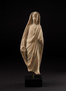 Terracotta statuette of a pious Roman veiling his head with his toga, 1st century