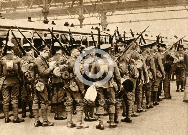 'Territorials from Summer Camp - Terriers entraining at Waterloo', 1914-1918, (1933).  Creator: Unknown.