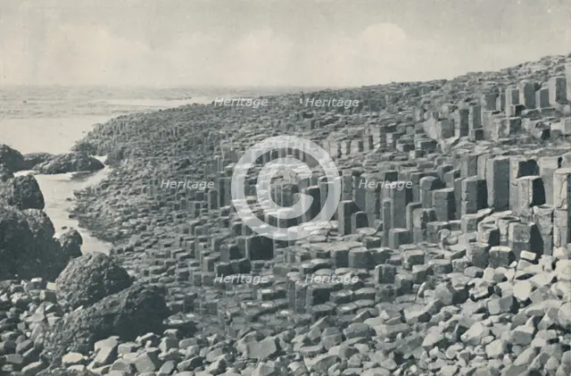 'Tessellated Promenade of the Grand Causeway Laid Down in Lava in the Far Distant Past', c1935. Artists: Unknown, W Lawrence.