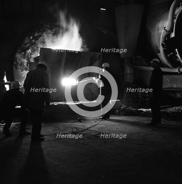 Testing temperature of molten steel, Park Gate Iron & Steel Co, Rotherham, South Yorkshire, 1964. Artist: Michael Walters