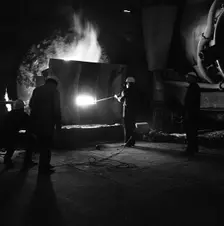 Testing temperature of molten steel, Park Gate Iron & Steel Co, Rotherham, South Yorkshire, 1964. Creator: Michael Walters