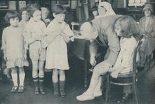 Testing the patella reflex for indication of nervous disease c1935