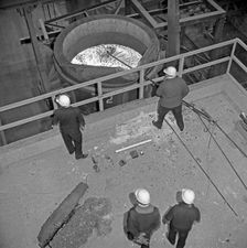 Testing the temperature of molten steel, Park Gate, Rotherham, South Yorkshire, 1964. Creator: Michael Walters