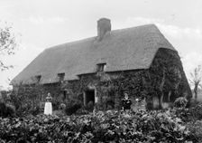 Thatched cottage with women standing outside, Shellingford, Oxfordshire, c1860-c1922. Artist: Henry Taunt