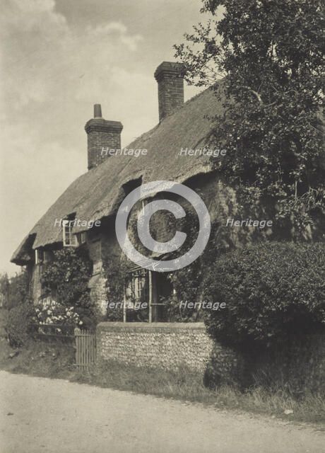Thatched cottage. From the album: Photograph album - England, 1920s. Creator: Harry Moult.