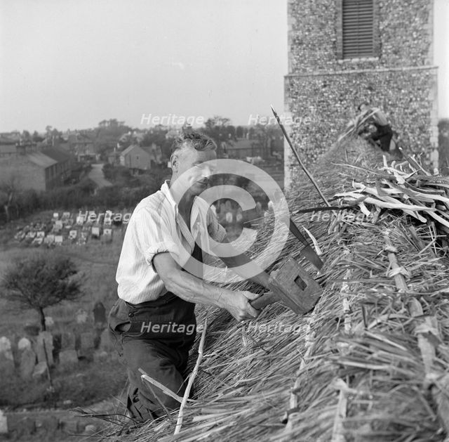 Thatching the roof of St Margaret & All Saints church, Pakefield, Suffolk, 1949. Artist: Hallam Ashley