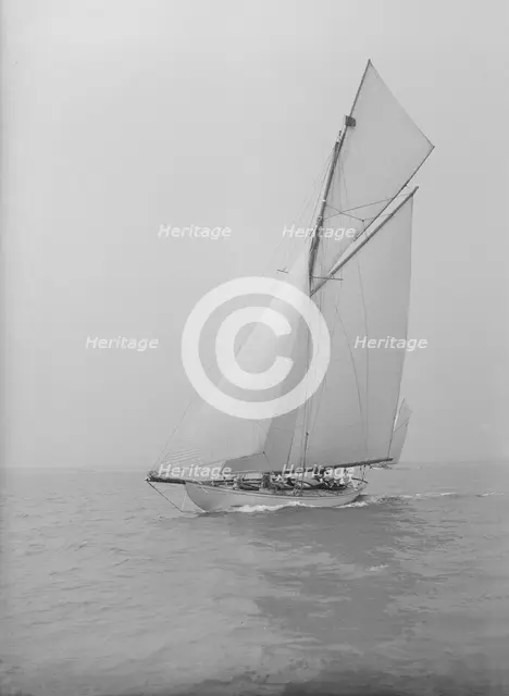 The 15 Metre cutter 'Ma'oona' sailing close-hauled, 1914. Creator: Kirk & Sons of Cowes.