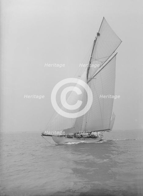 The 15 Metre cutter 'Ma'oona' sailing close-hauled, 1914. Creator: Kirk & Sons of Cowes.