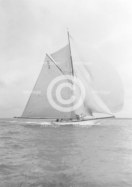 The 15 Metre cutter 'Ostara' broad reaching, 1912. Creator: Kirk & Sons of Cowes.