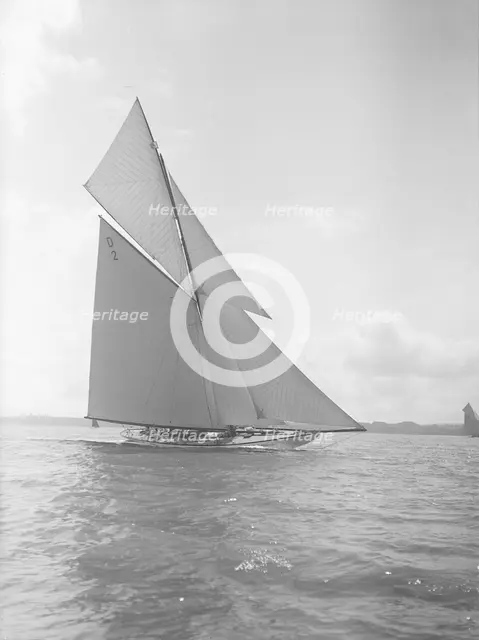 The 15-metre cutter 'Ostara' sailing close-hauled, 1911. Creator: Kirk & Sons of Cowes.