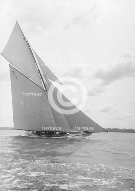 The 15 Metre cutter 'Ostara' sailing close-hauled, 1912. Creator: Kirk & Sons of Cowes.