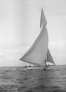 The 15-metre cutter Ostara sailing downwind, 1911. Creator: Kirk & Sons of Cowes