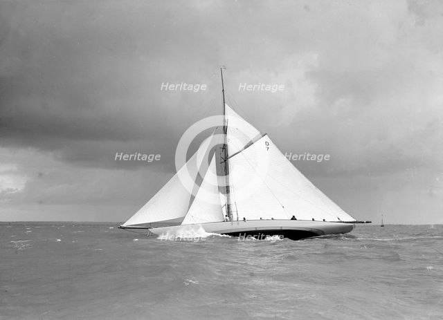 The 15 Metre class sailing yacht 'Istria' close-hauled and heeling in fresh breeze, 1912.  Creator: Kirk & Sons of Cowes.