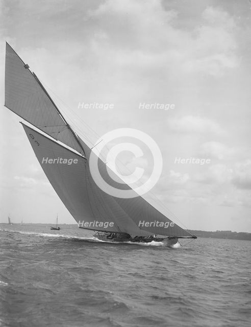 The 15 Metre sailing yacht 'Jeano' making good headway, 1911. Creator: Kirk & Sons of Cowes.