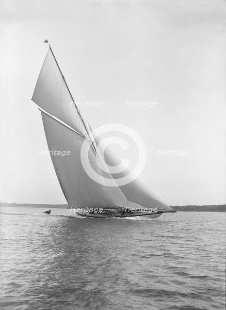 The 15 Metre sailing yacht 'Paula III' in fine form, 1913. Creator: Kirk & Sons of Cowes.
