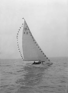 The 18-foot keelboat Prudence (K2) with prize flags, 1922. Creator: Kirk & Sons of Cowes