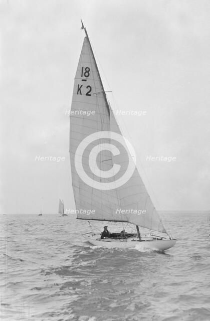 The 18-foot keelboat 'Prudence' (K2) under sail, 1922. Creator: Kirk & Sons of Cowes.