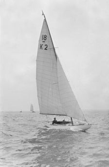 The 18-foot keelboat Prudence (K2) under sail, 1922. Creator: Kirk & Sons of Cowes