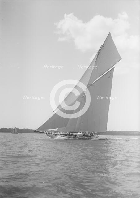 The 19-metre cutter 'Norada' sailing close-hauled, 1911. Creator: Kirk & Sons of Cowes.