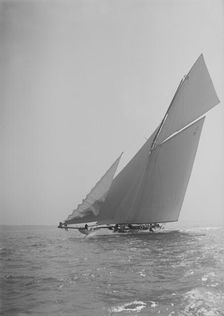 The 19-metre cutter Norada sailing close-hauled, jib flapping, 1911. Creator: Kirk & Sons of Cowes