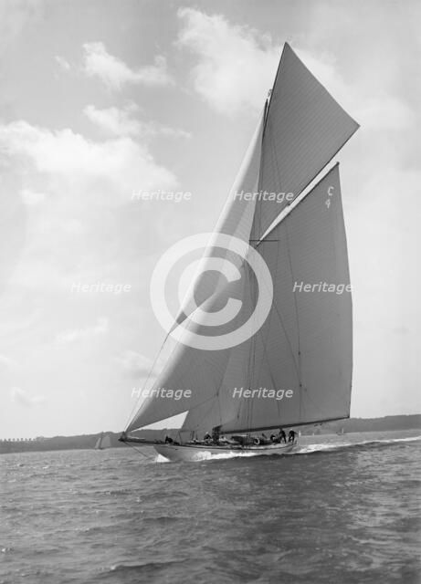 The 19-metre cutter 'Norada' sailing close reaching, 1911. Creator: Kirk & Sons of Cowes.