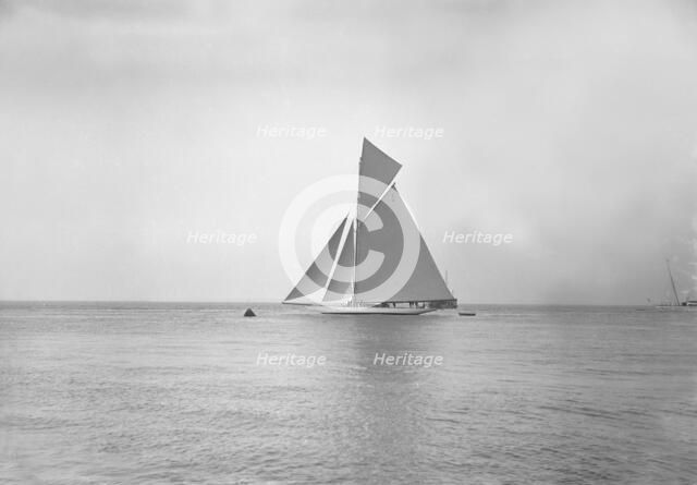The 19-metre cutter 'Norada' sailing in gentle winds, 1911. Creator: Kirk & Sons of Cowes.