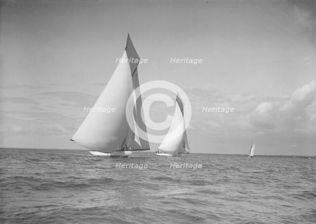 The 19-metre class 'Mariquita' & 'Corona' race downwind under spinnaker, 1911. Creator: Kirk & Sons of Cowes.