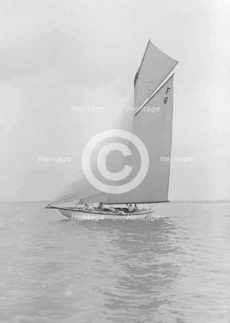 The 10 Metre class 'Eleda' (F6) sailing close-hauled, 1913. Creator: Kirk & Sons of Cowes.