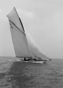 The 10 Metre class Eleda (F6) sailing close-hauled, 1914. Creator: Kirk & Sons of Cowes