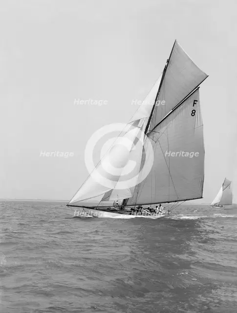 The 10 Metre class 'Pampero' (F8) sailing close-hauled, 1914. Creator: Kirk & Sons of Cowes.