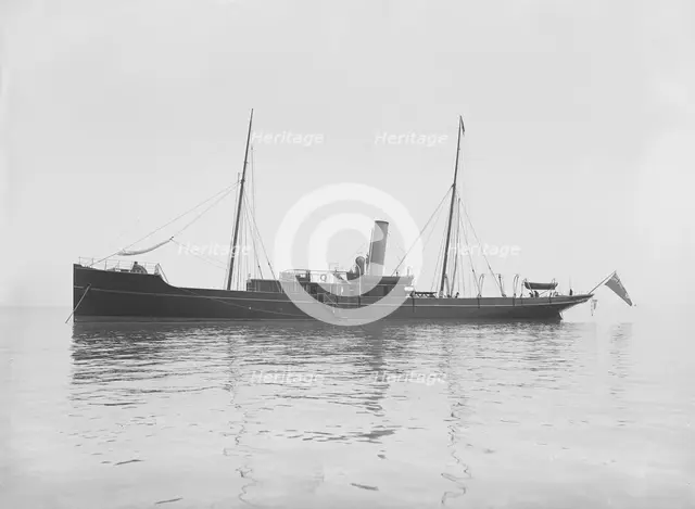 The 116 ton steam yacht 'Athena' at anchor, 1911. Creator: Kirk & Sons of Cowes.
