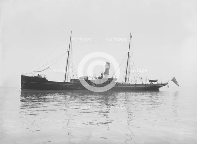 The 116 ton steam yacht 'Athena' at anchor, 1911. Creator: Kirk & Sons of Cowes.