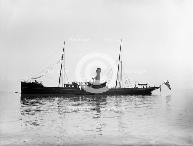 The 116 ton steam yacht 'Athena' at anchor, 1911. Creator: Kirk & Sons of Cowes.