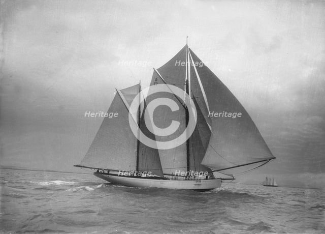 The 118 foot racing yacht 'Cariad', 1912. Creator: Kirk & Sons of Cowes.