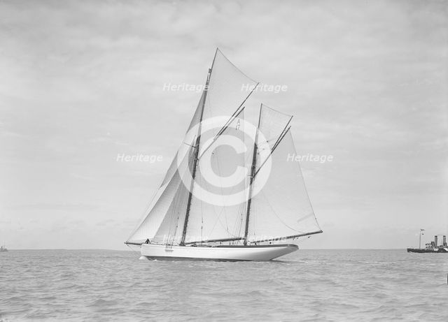 The 118 foot racing yacht 'Cariad' sailing close-hauled, 1911. Creator: Kirk & Sons of Cowes.