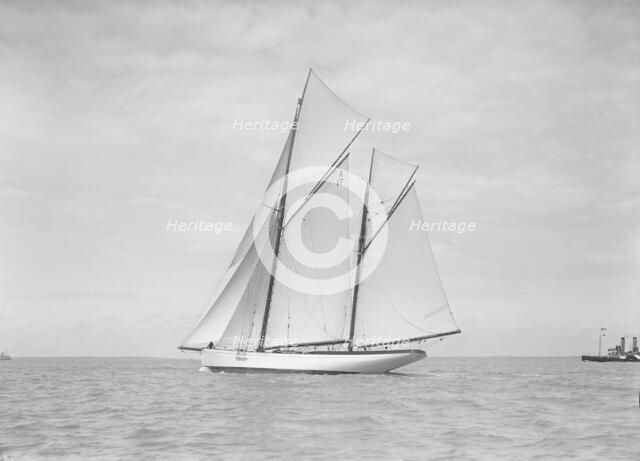 The 118 foot racing yacht 'Cariad' sailing close-hauled, 1911. Creator: Kirk & Sons of Cowes.