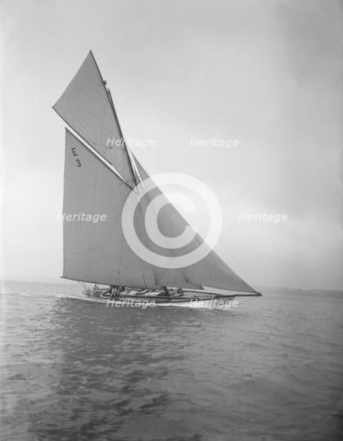 The 12-metre 'Ierne' sailing close-hauled, 1911. Creator: Kirk & Sons of Cowes.
