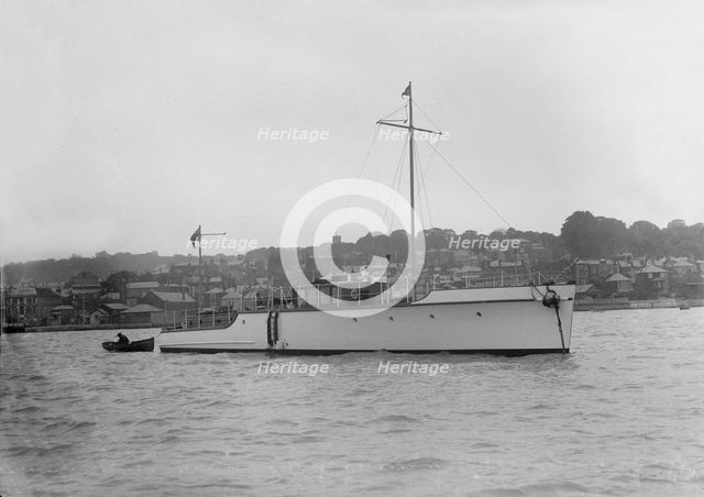 The 12 ton motor yacht 'Cordon Rouge' at anchor, 1923. Creator: Kirk & Sons of Cowes.
