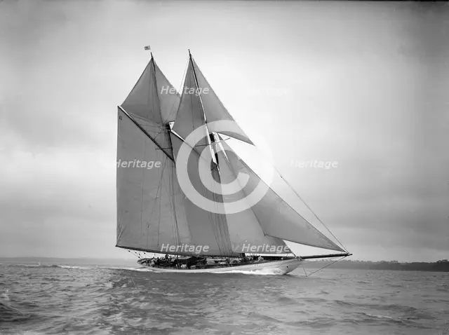 The 250 ton schooner 'Germania' sails close-hauled, 1911. Creator: Kirk & Sons of Cowes.