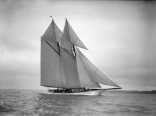 The 250 ton schooner Germania sails close-hauled, 1911. Creator: Kirk & Sons of Cowes