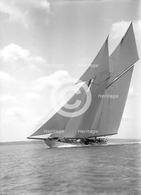 The 250 ton schooner 'Germania' sails close-hauled, 1911. Creator: Kirk & Sons of Cowes.
