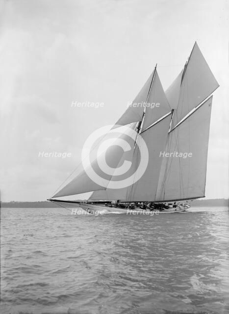 The 250 ton schooner 'Germania' sails close-hauled, 1913. Creator: Kirk & Sons of Cowes.