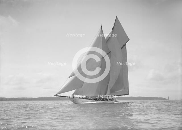 The 250 ton schooner 'Germania' sails close reach, 1911. Creator: Kirk & Sons of Cowes.