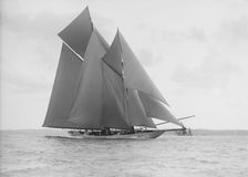 The 250 ton schooner Germania sails on a reach, 1913. Creator: Kirk & Sons of Cowes