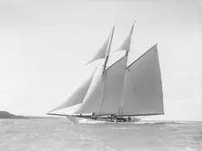 The 250 ton schooner Germania reaching in stiff wind, 1912. Creator: Kirk & Sons of Cowes