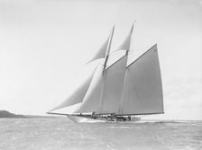 The 250 ton schooner Germania reaching in stiff wind, 1912. Creator: Kirk & Sons of Cowes