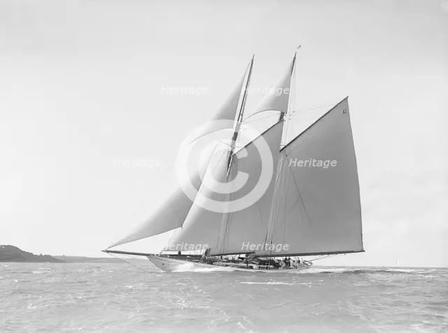 The 250 ton schooner 'Germania' reaching in stiff wind, 1912. Creator: Kirk & Sons of Cowes.