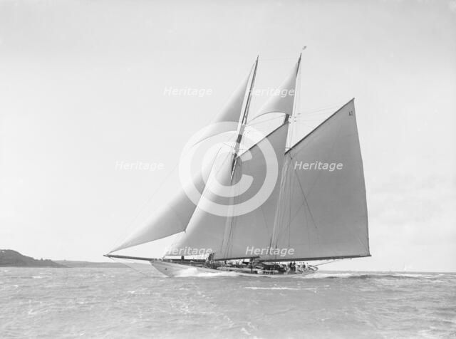 The 250 ton schooner 'Germania' reaching in stiff wind, 1912. Creator: Kirk & Sons of Cowes.