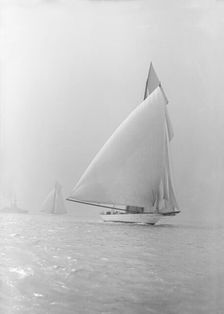 The 250 ton schooner Germania running under spinnaker, 1913. Creator: Kirk & Sons of Cowes