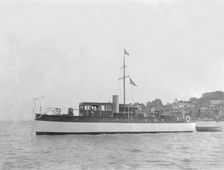 The 28 ton motor yacht Edina at anchor, 1921. Creator: Kirk & Sons of Cowes